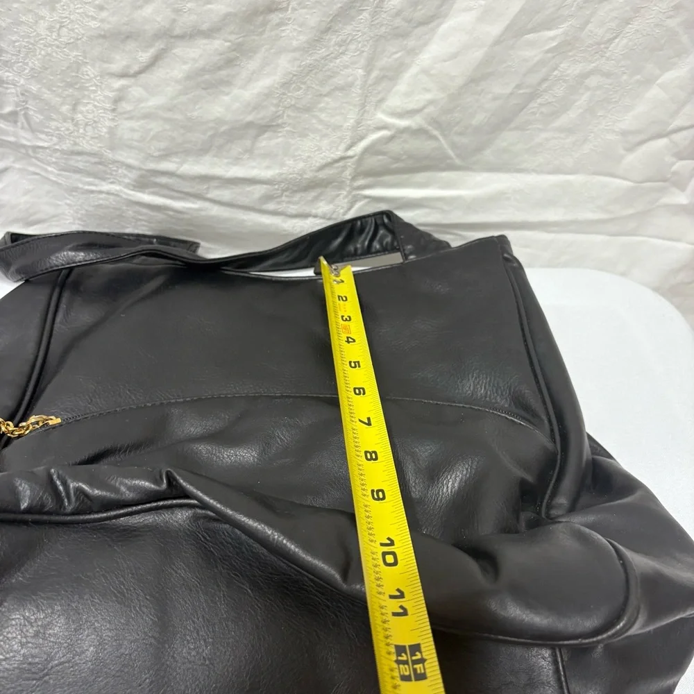 Black tote bag with a tassel accent. - Picture 12 of 12